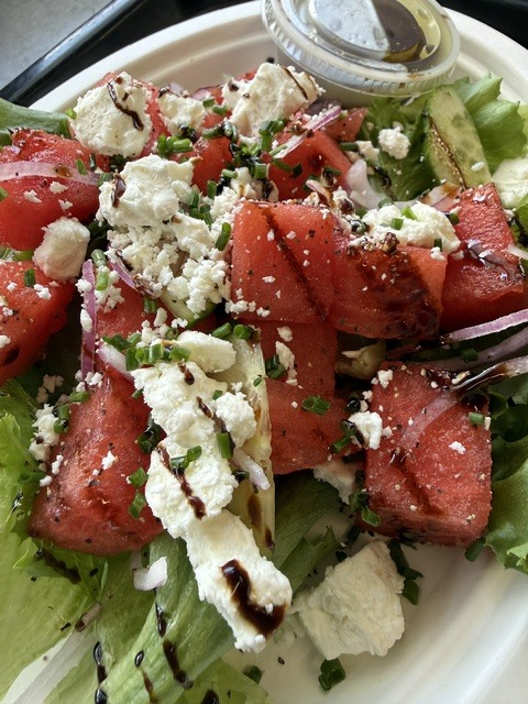 Watermelon feta salad with balsamic drizzle, red onion, and chives