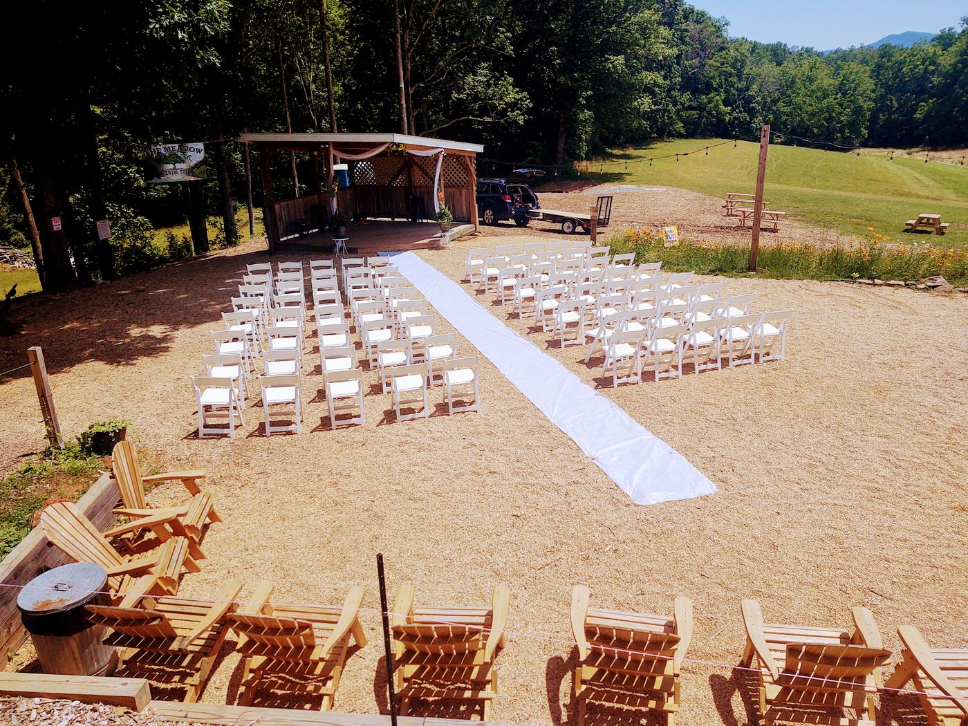A wedding ceremony set up on the meadow at Brewing Tree